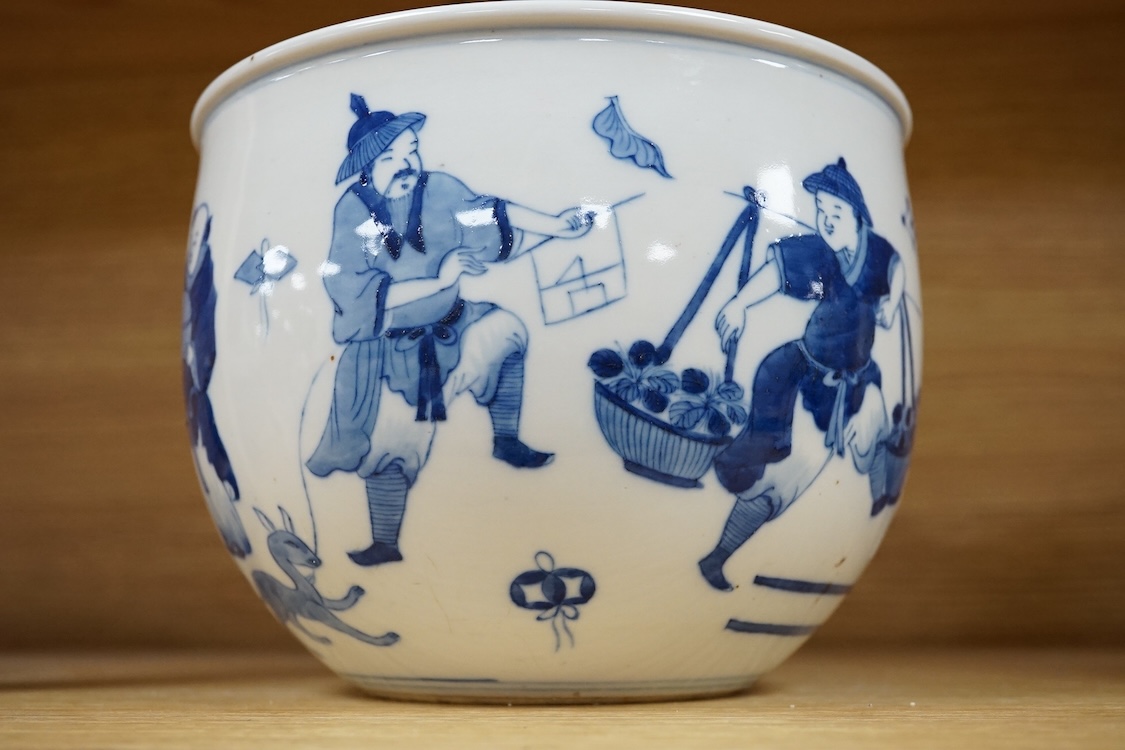 A small Chinese blue and white jardiniere painted with figures at various pursuits, 19cm in diameter